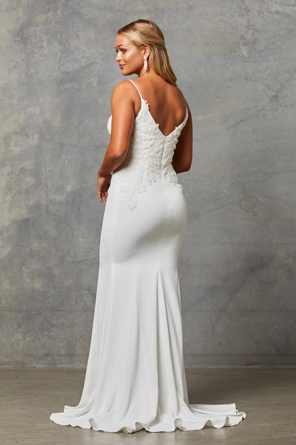 The back of a bride wearing a Crepe Fit and Flare Wedding Dress