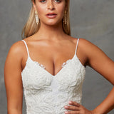 A portrait close up of a bride wearing a Crepe Fit and Flare Wedding Dress