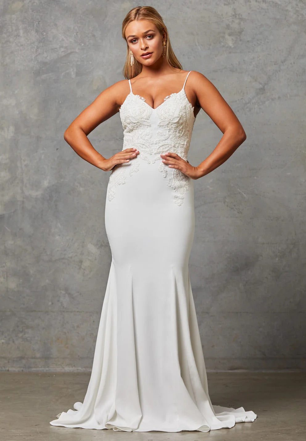 Bride wearing a Crepe Fit and Flare Wedding Dress