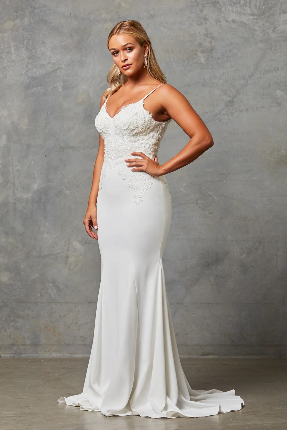 Bride wearing a Crepe Fit and Flare Wedding Dress