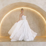 Wintor embroidered lace ballgown wedding dress with strapless sweetheart basque bodice and full lace skirt.
