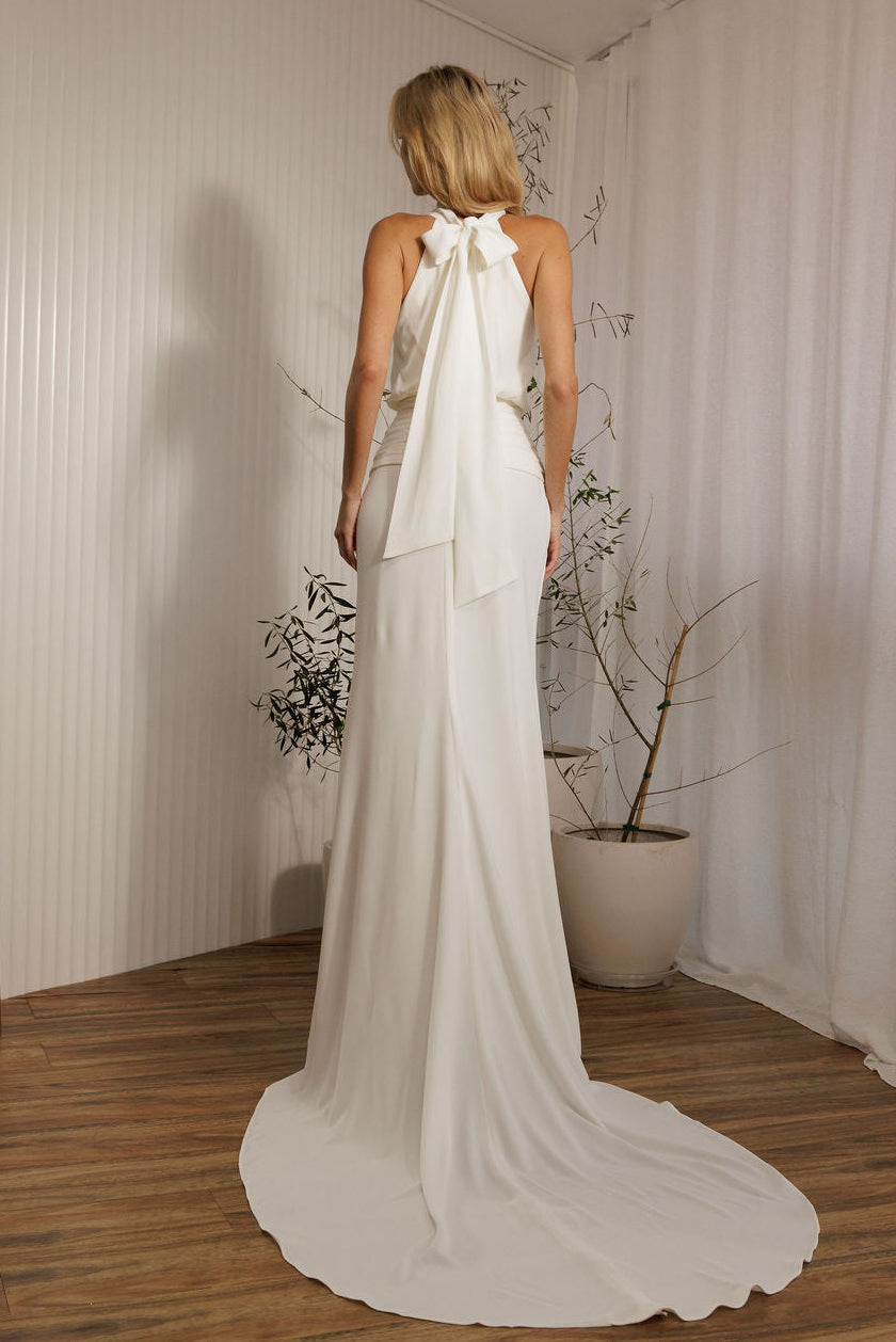 Back view of Aston modern minimalist wedding dress with halter tie detail and sleek silhouette