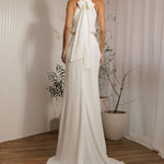 Back view of Aston modern minimalist wedding dress with halter tie detail and sleek silhouette
