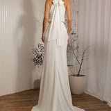 Back view of Aston modern minimalist wedding dress with halter tie detail and sleek silhouette