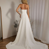 Austin minimalist wedding dress back view with button detail and flowing train