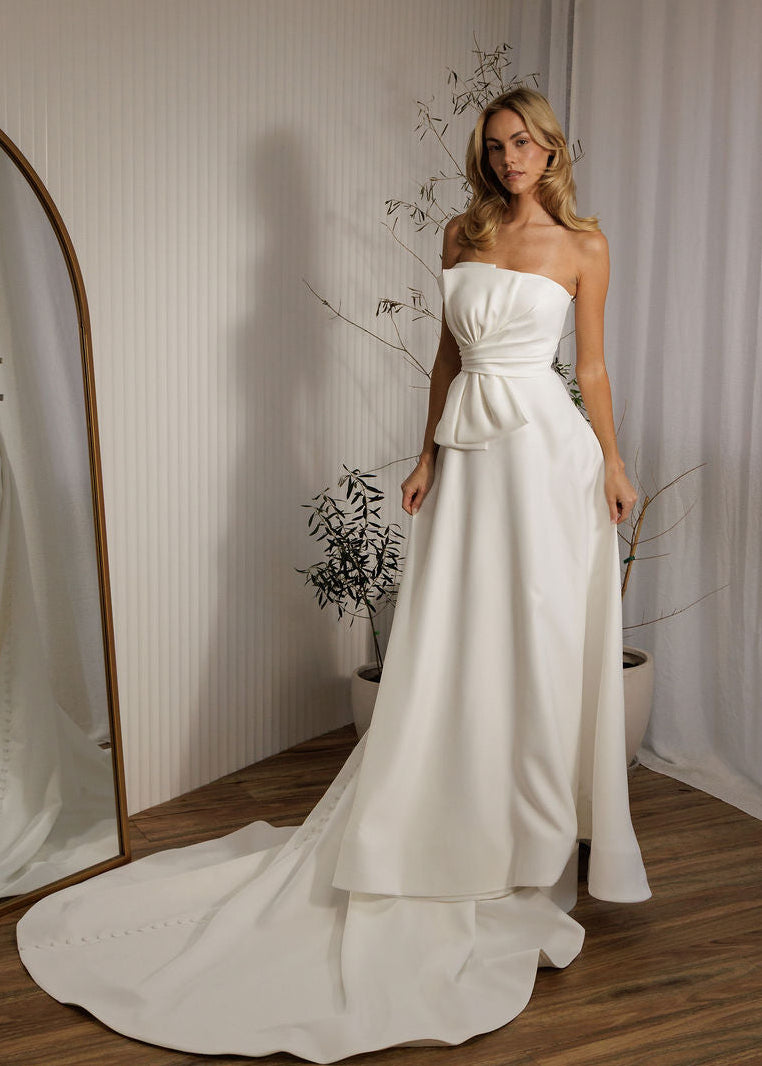 Austin minimalist wedding dress with strapless bodice and sleek ivory silhouette
