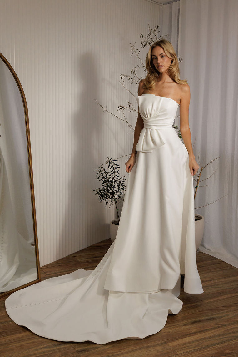Austin minimalist wedding dress with strapless bodice and sleek ivory silhouette