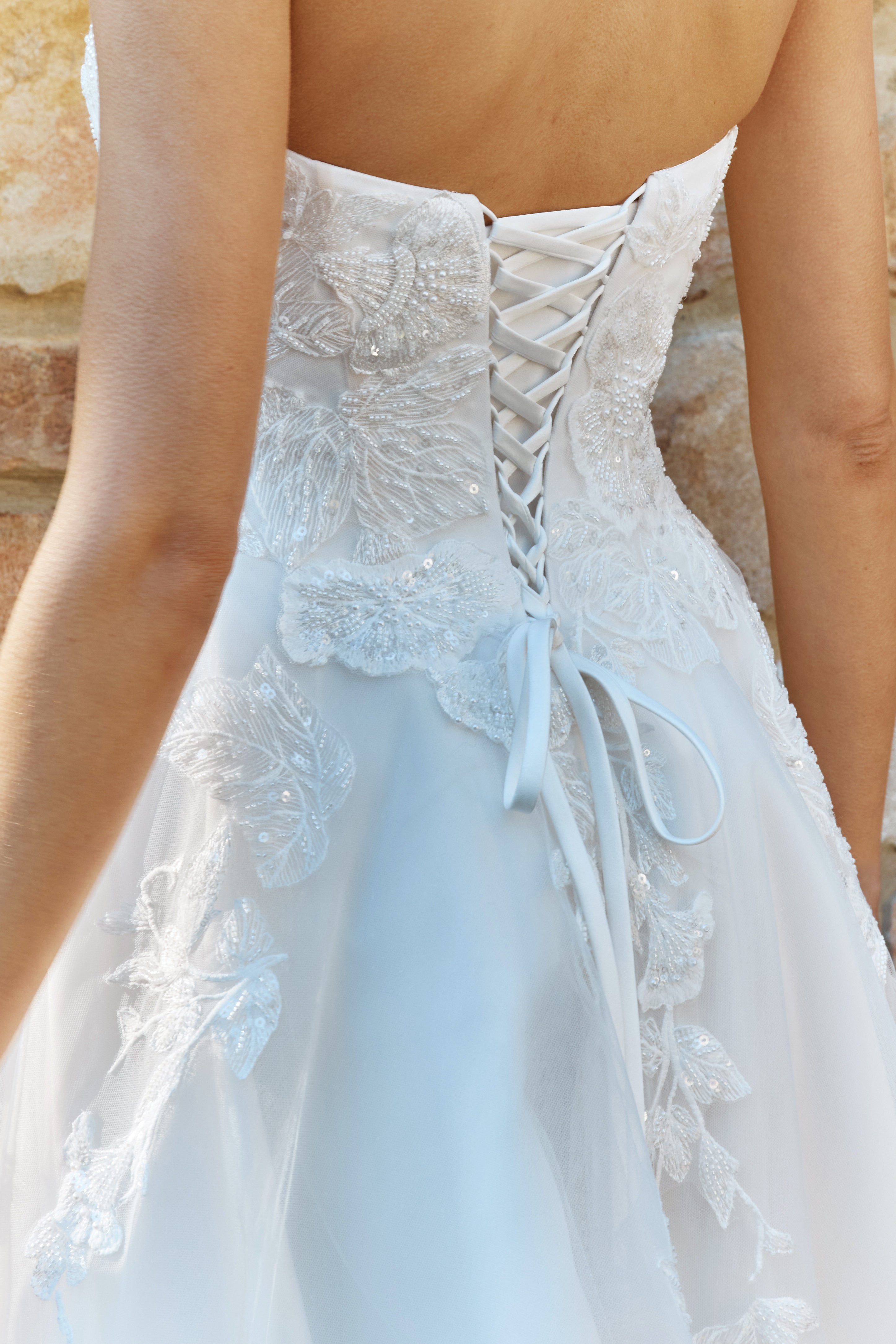 Close-up of a Lace A-Line Wedding Dress with lace details.