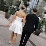 Bardot wedding dress in Brisbane featuring strapless neckline and playful mini silhouette
