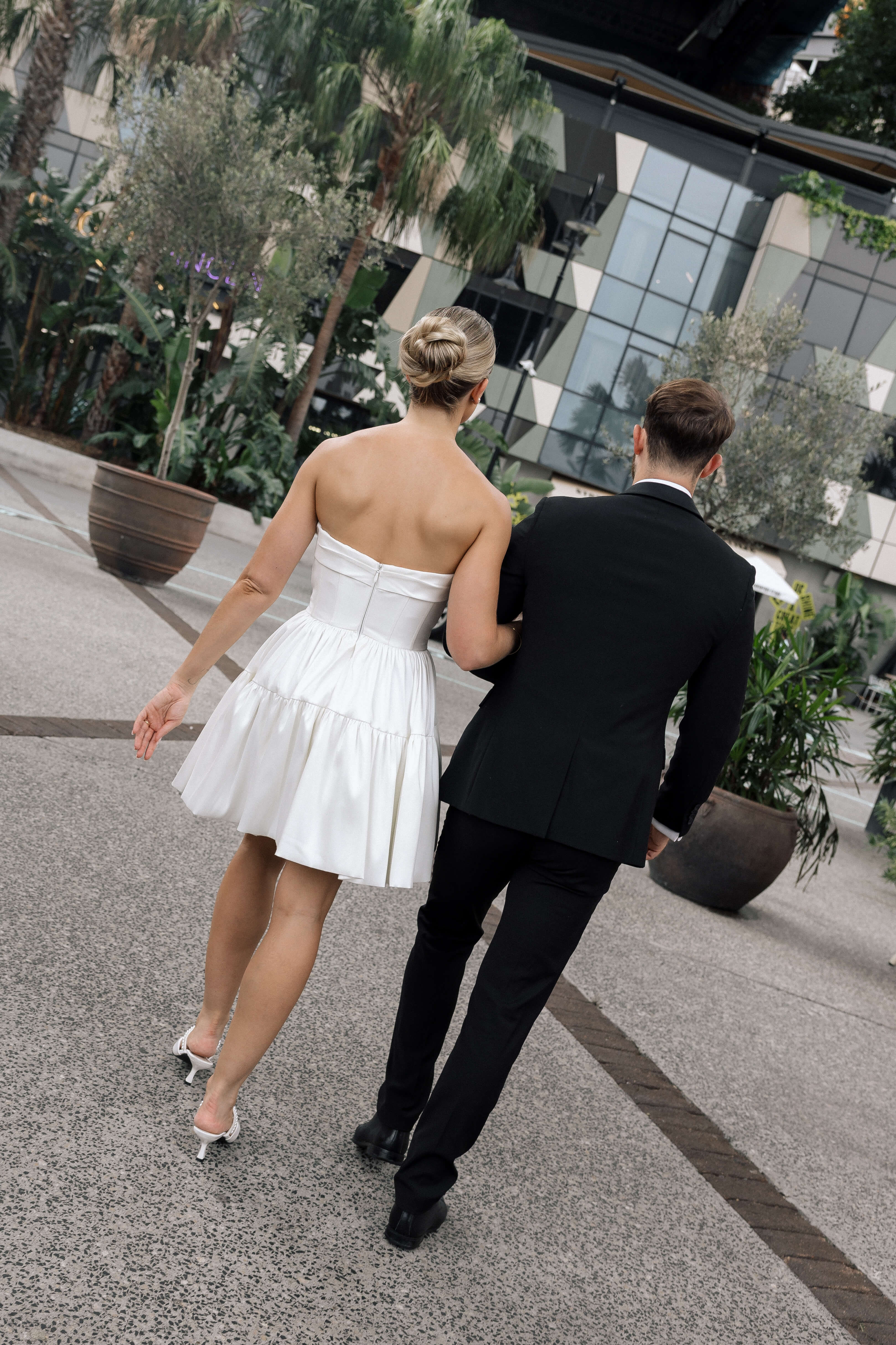Bardot wedding dress in Brisbane featuring strapless neckline and playful mini silhouette