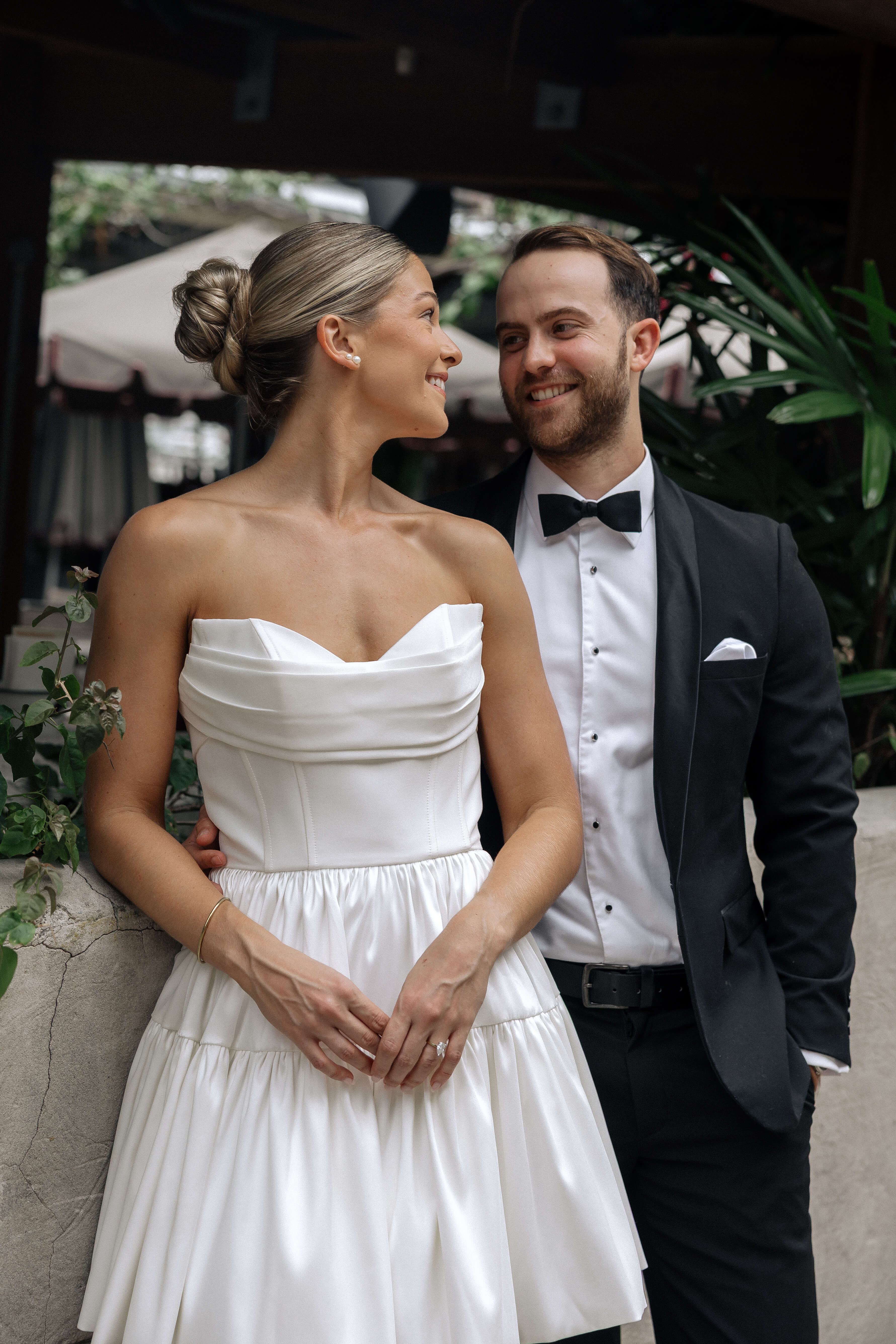 Bardot wedding dress in Brisbane featuring strapless neckline and playful mini silhouette