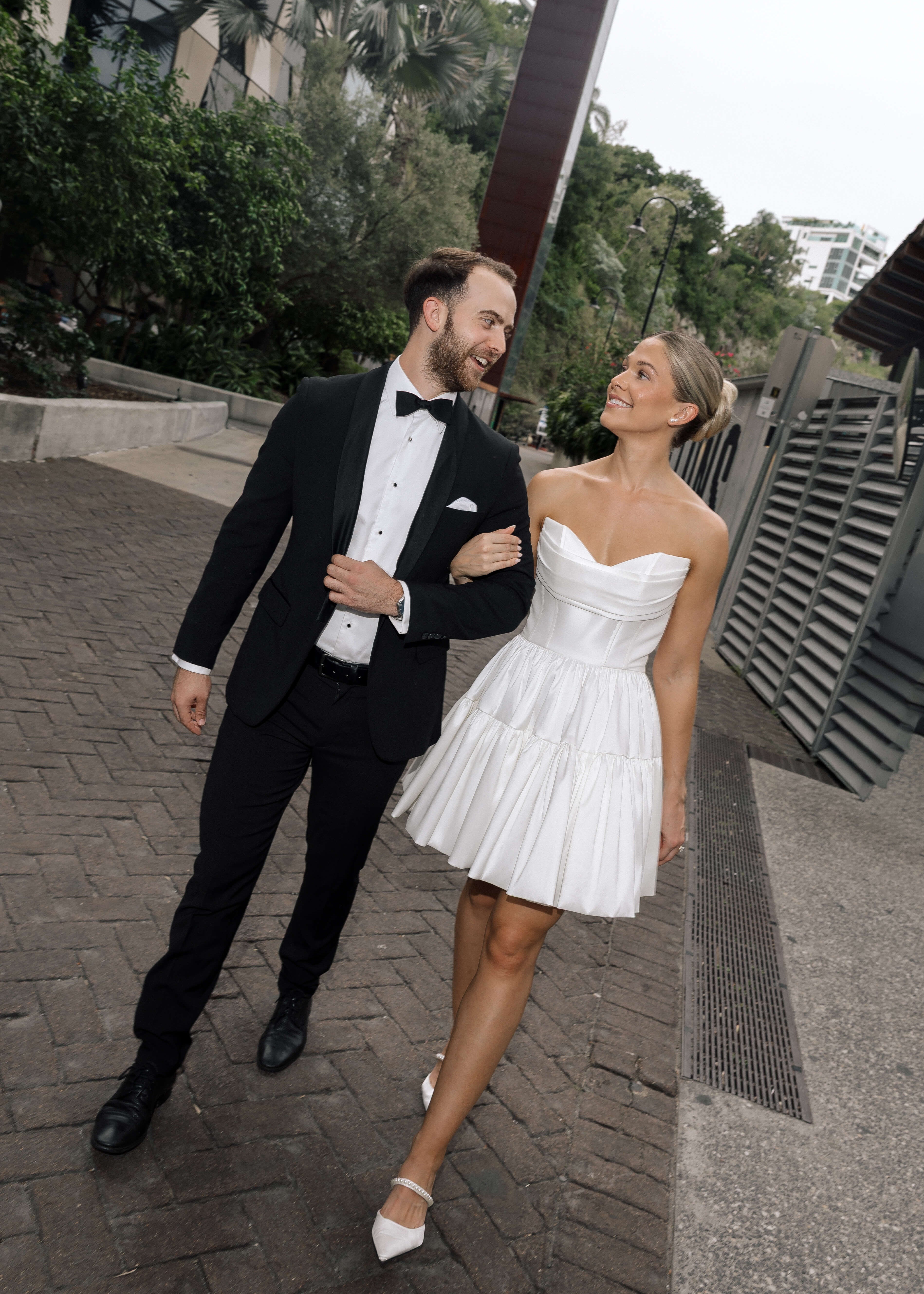 Bardot wedding dress in Brisbane featuring strapless neckline and playful mini silhouette