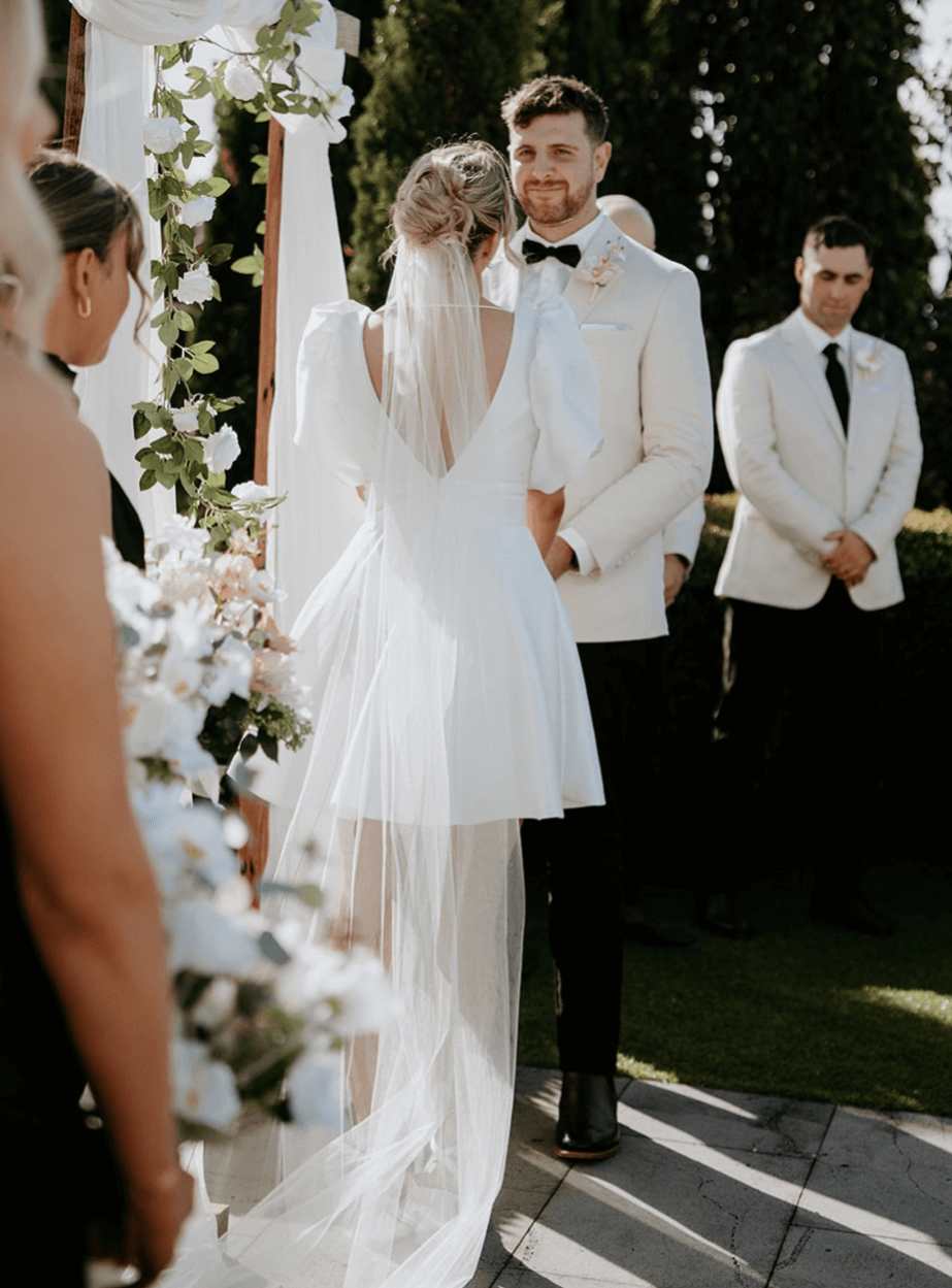 Belle Mini wedding dress in Brisbane featuring short A-line silhouette and puff sleeves