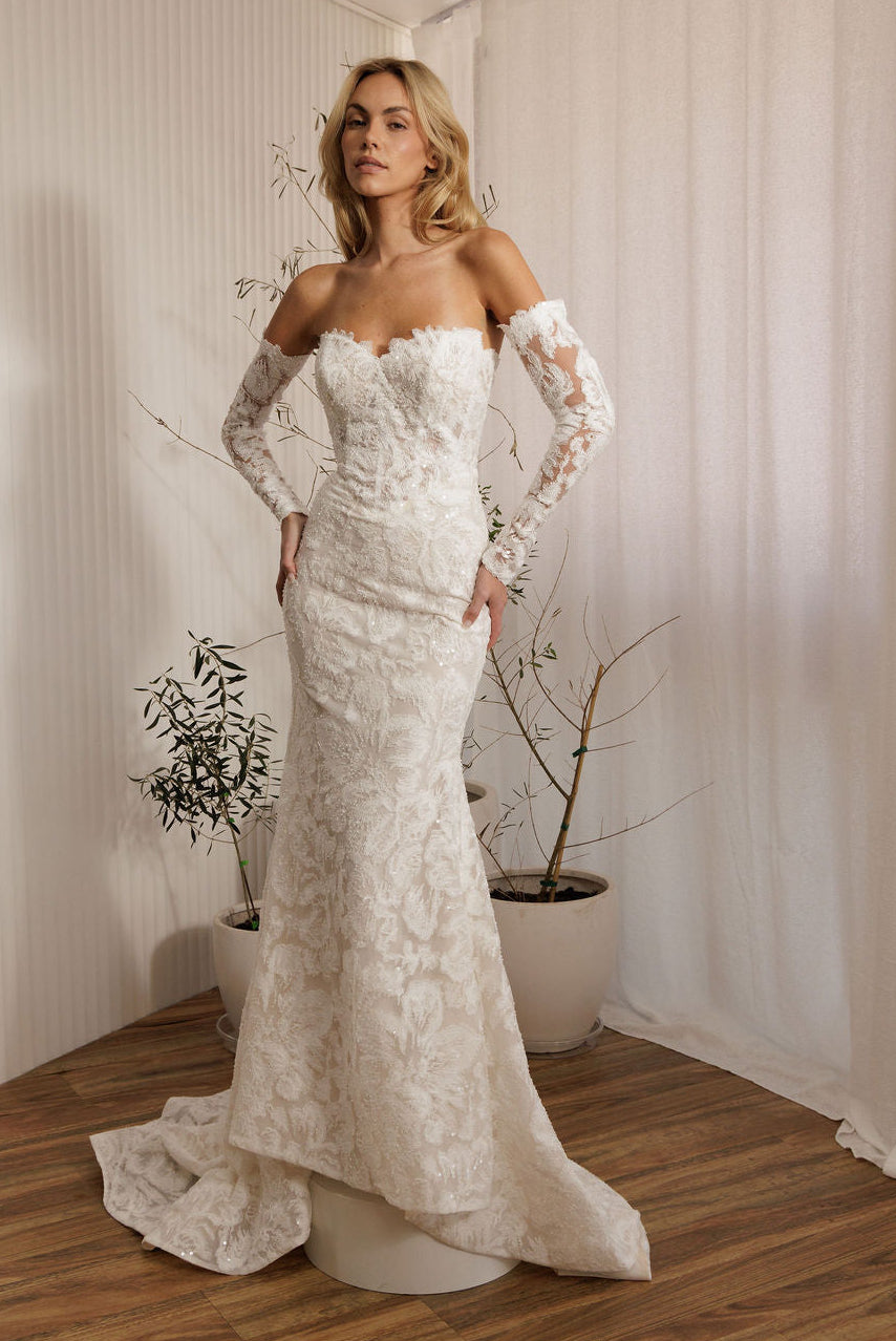 Ivory lace fit-and-flare delicate beaded lace statement gown wedding dress with sweetheart neckline and long lace sleeves