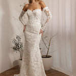 Ivory lace fit-and-flare delicate beaded lace statement gown wedding dress with sweetheart neckline and long lace sleeves