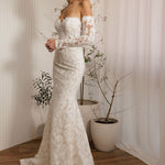 Ivory lace fit-and-flare wedding dress with sweetheart neckline and off-the-shoulder lace sleeves side view