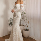 Ivory lace fit-and-flare wedding dress with sweetheart neckline and off-the-shoulder lace sleeves side view