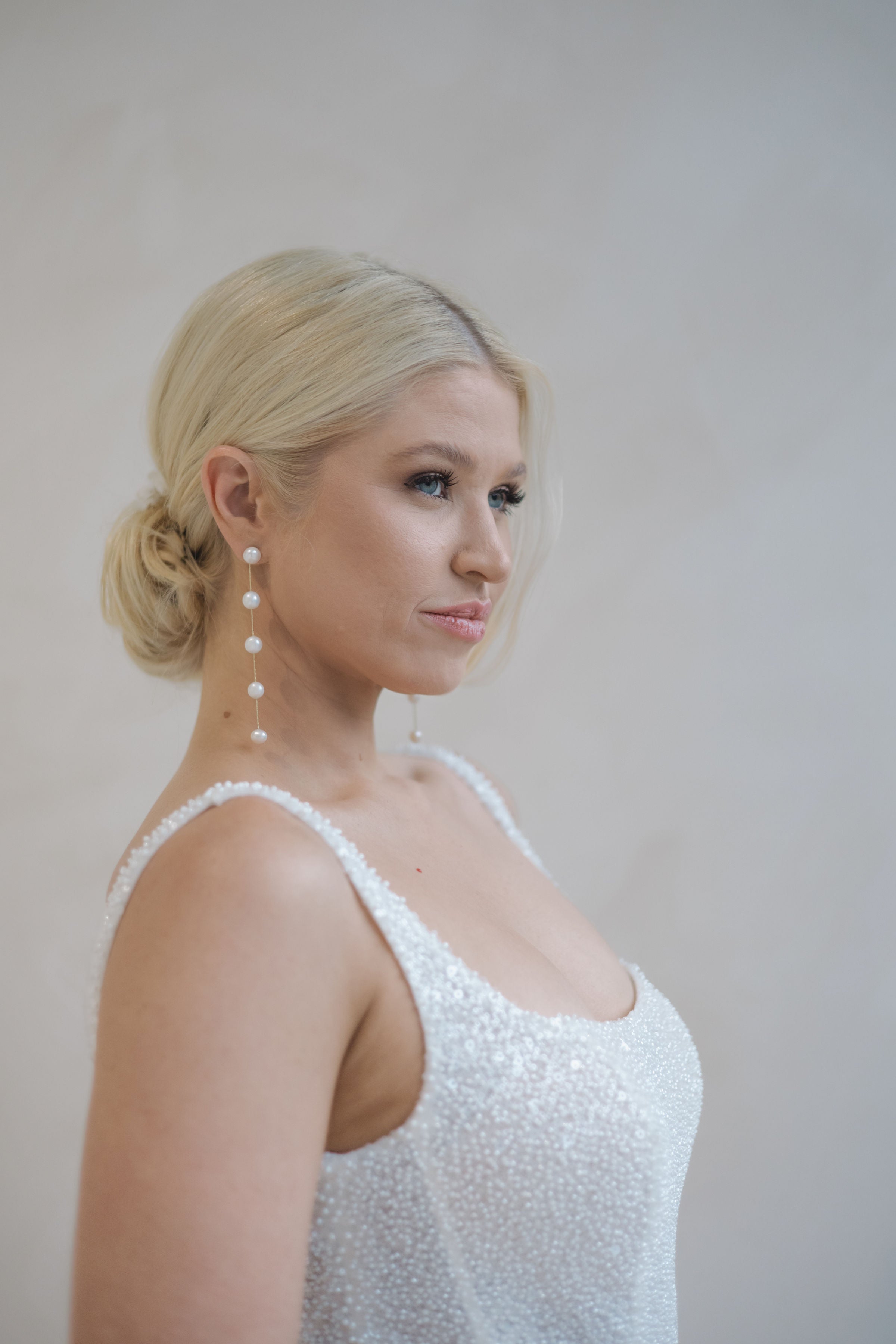 Side profile of a bride in a Beaded A-Line Wedding Dress