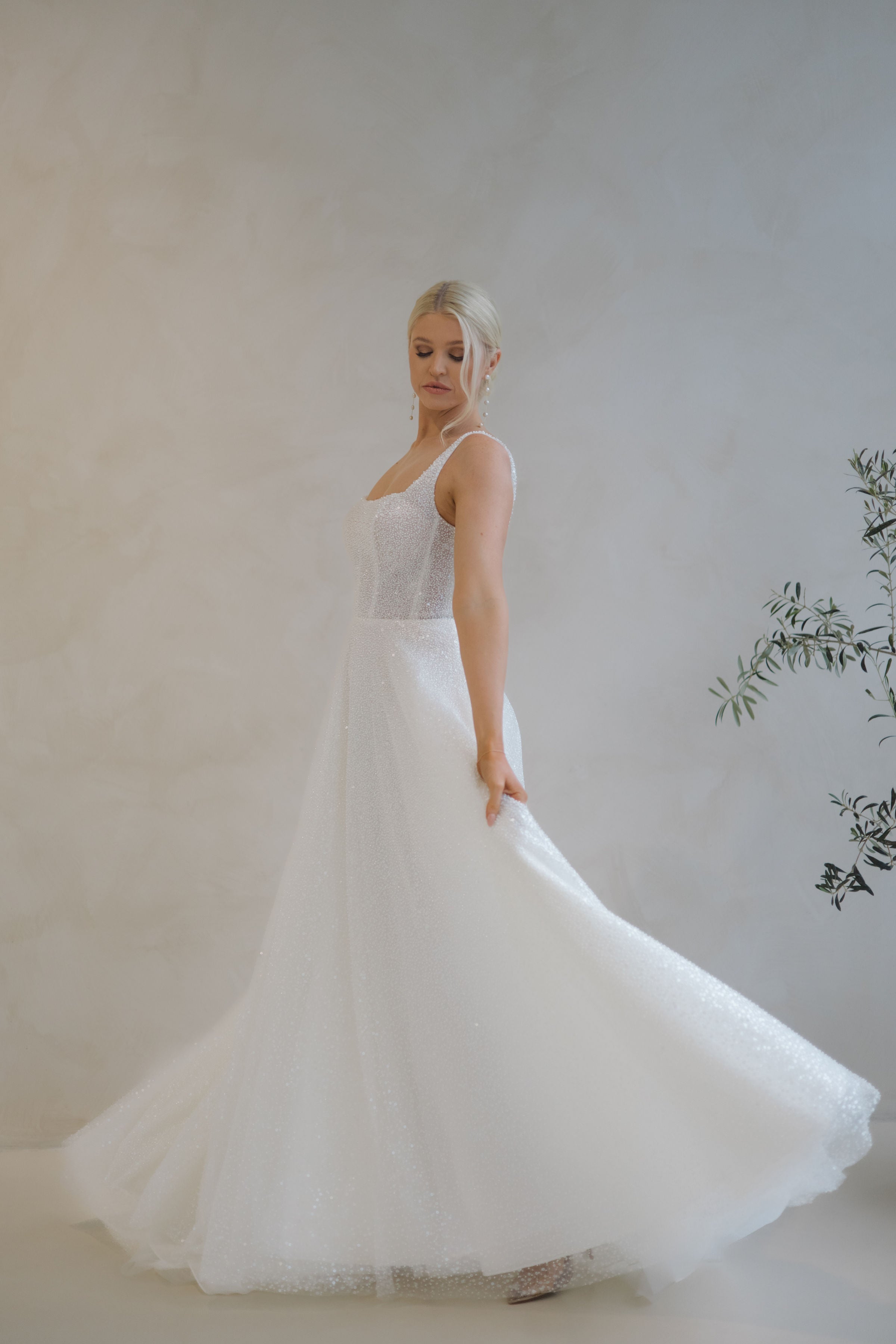 Bride spinning in a Beaded A-Line Wedding Dress