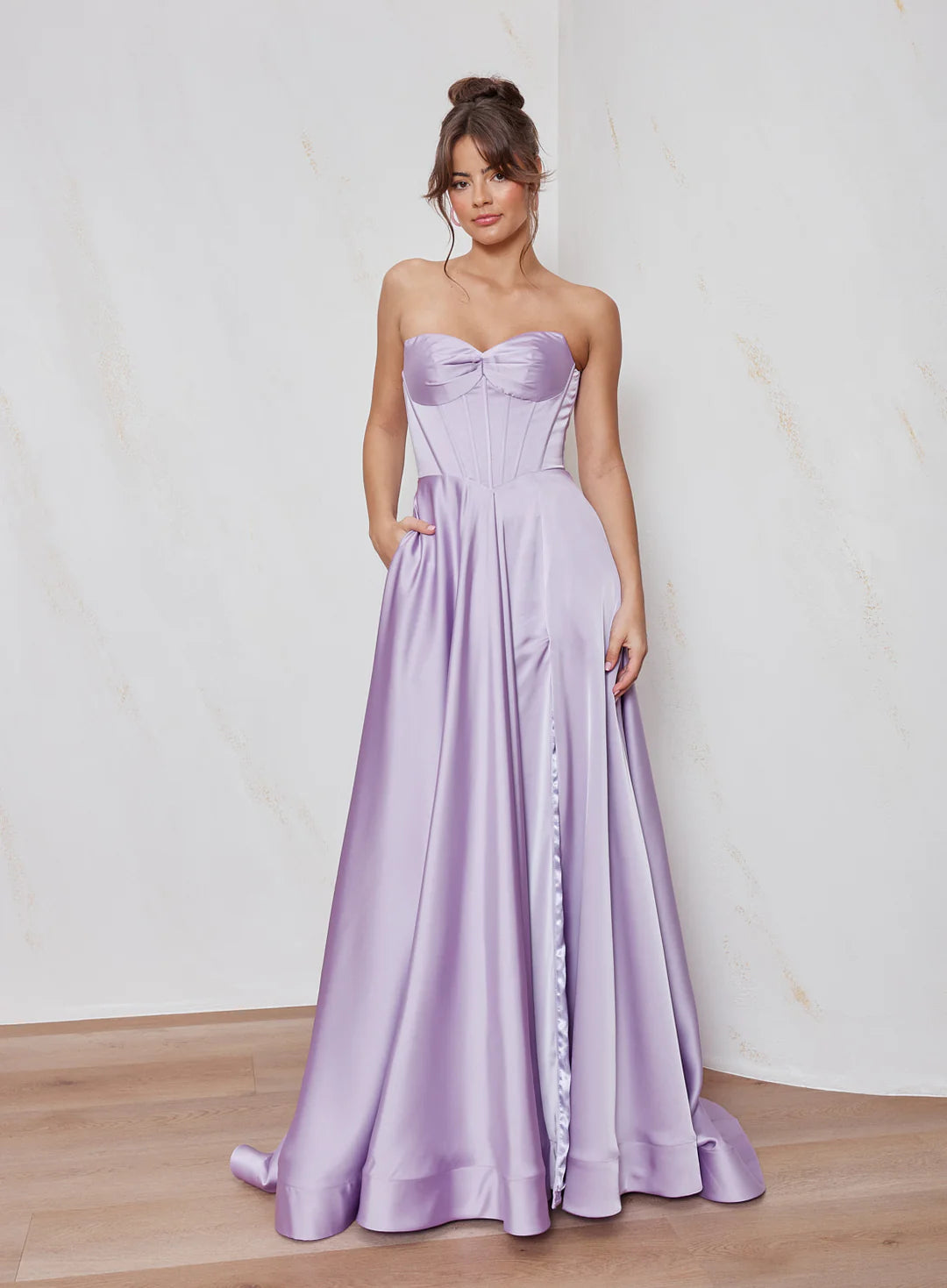Celine satin A-line formal dress in lilac with strapless corset bodice and structured flowing skirt.