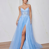 Woman wearing a light blue evening gown with a high slit on a plain background