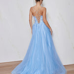 Woman wearing a light blue evening gown with a white background