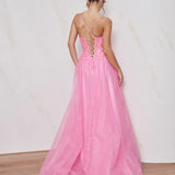 Pink evening gown with open back on a plain background