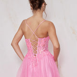 Pink dress with criss-cross back design on a light background