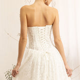 Woman wearing a Lace Strapless A-Line Wedding Dress against a neutral background
