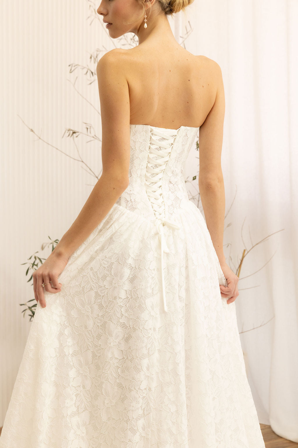 Lace Strapless A-Line Wedding Dress on a neutral background