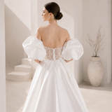 Heston wedding dress back view with lace bodice detail, puff sleeves and full satin skirt with train.