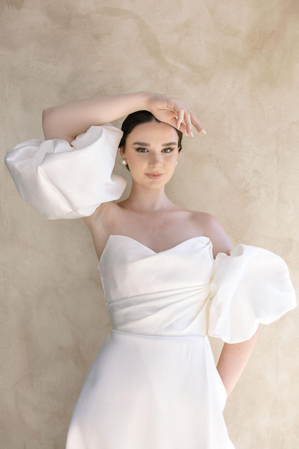 Heston wedding dress with strapless bodice and detachable puff sleeves.