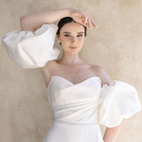 Heston wedding dress with strapless bodice and detachable puff sleeves.