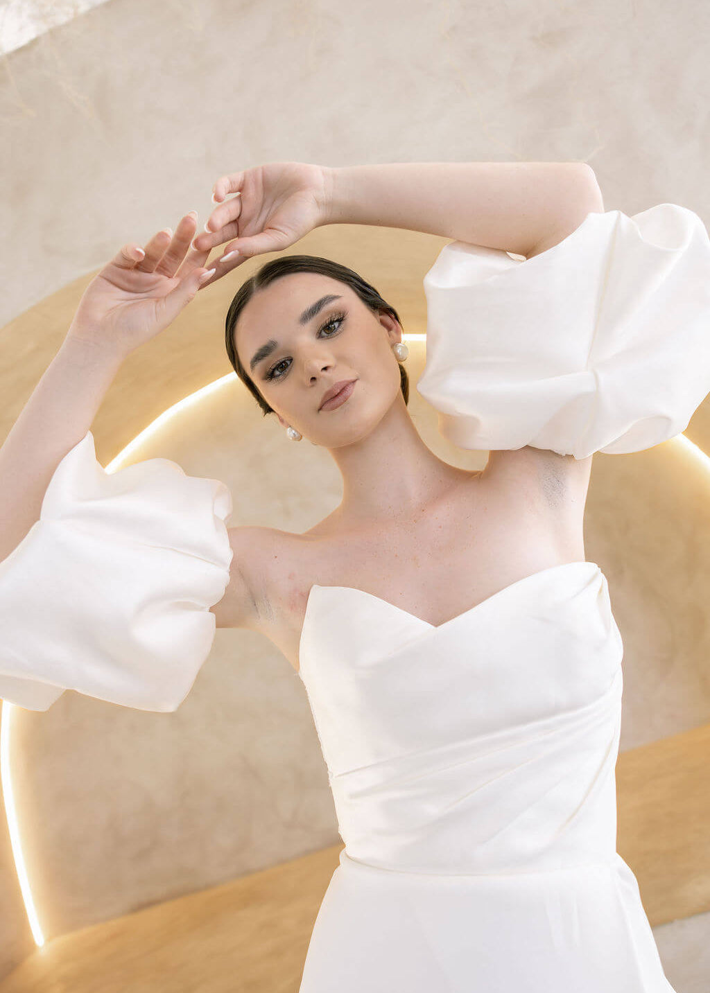 Heston wedding dress with strapless bodice and detachable puff sleeves.
