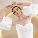 Heston wedding dress with strapless bodice and detachable puff sleeves.
