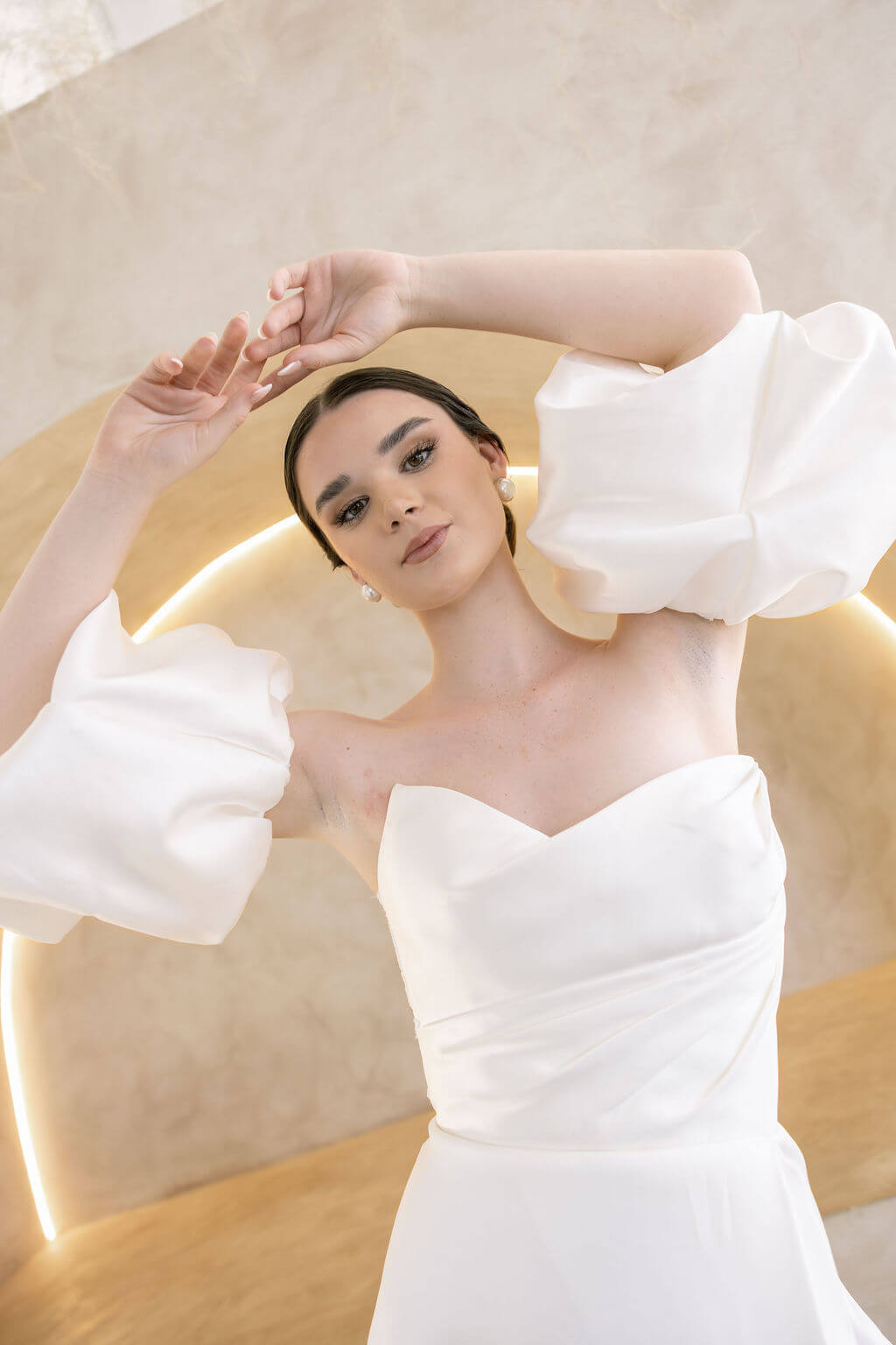 Heston wedding dress with strapless bodice and detachable puff sleeves.
