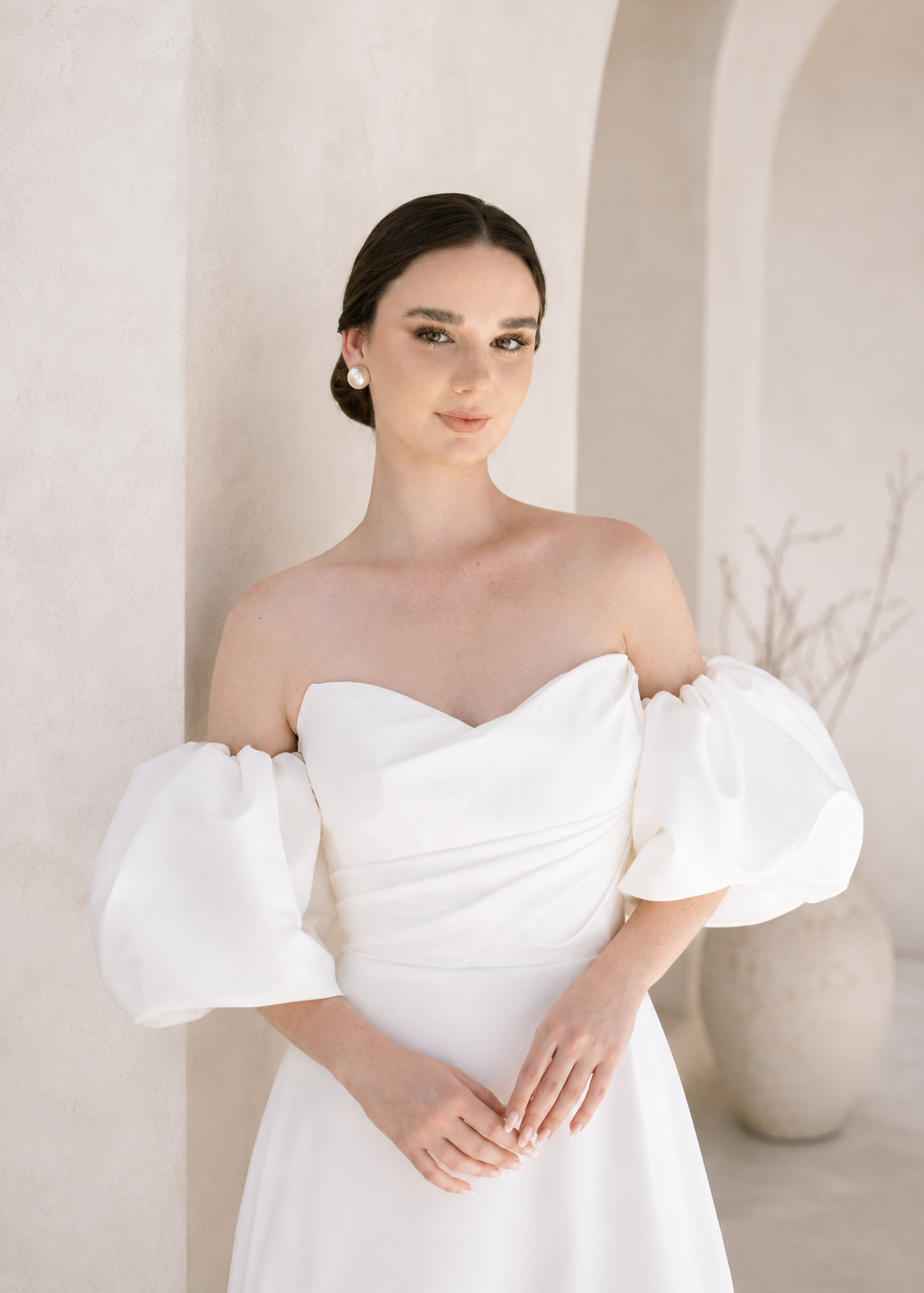 Heston wedding dress with strapless bodice and detachable puff sleeves.