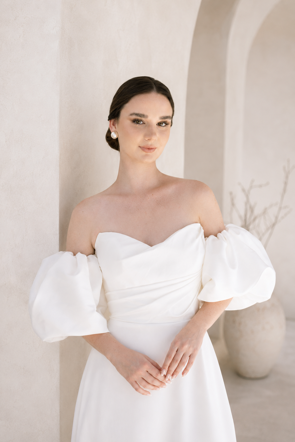 Heston wedding dress with strapless bodice and detachable puff sleeves.