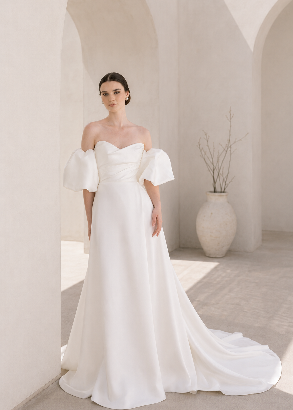 Heston wedding dress with puff sleeves, fitted bodice and satin skirt with leg split.