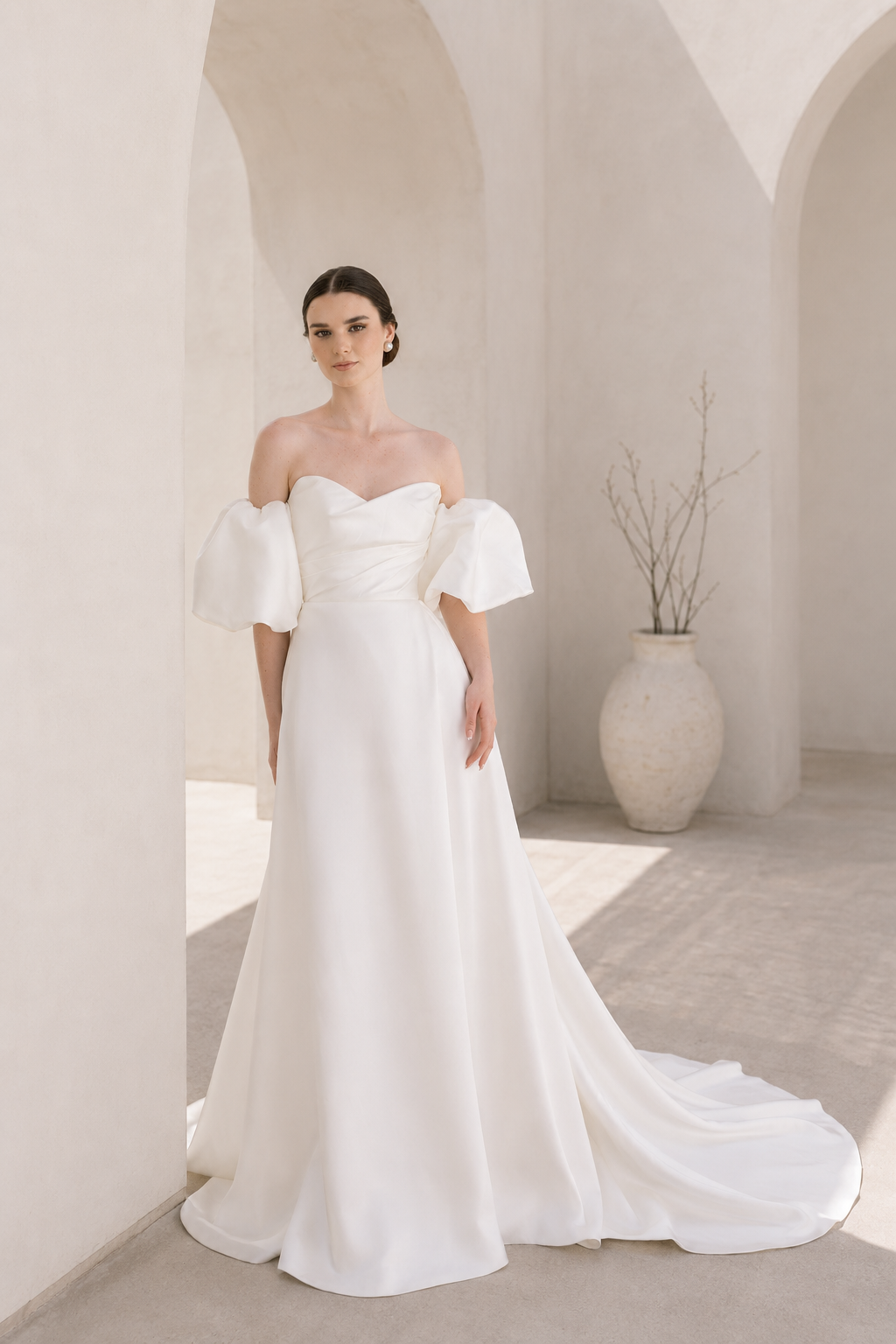 Heston wedding dress with puff sleeves, fitted bodice and satin skirt with leg split.
