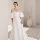 Heston wedding dress with puff sleeves, fitted bodice and satin skirt with leg split.