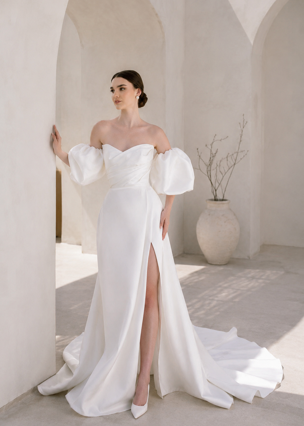 Heston wedding dress with puff sleeves, fitted bodice and satin skirt with leg split.