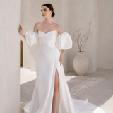 Heston wedding dress with puff sleeves, fitted bodice and satin skirt with leg split.