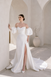Heston wedding dress with puff sleeves, fitted bodice and satin skirt with leg split.