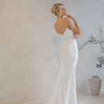 Intentions crepe satin fit-and-flare wedding dress with sweetheart neckline and elegant open back.
