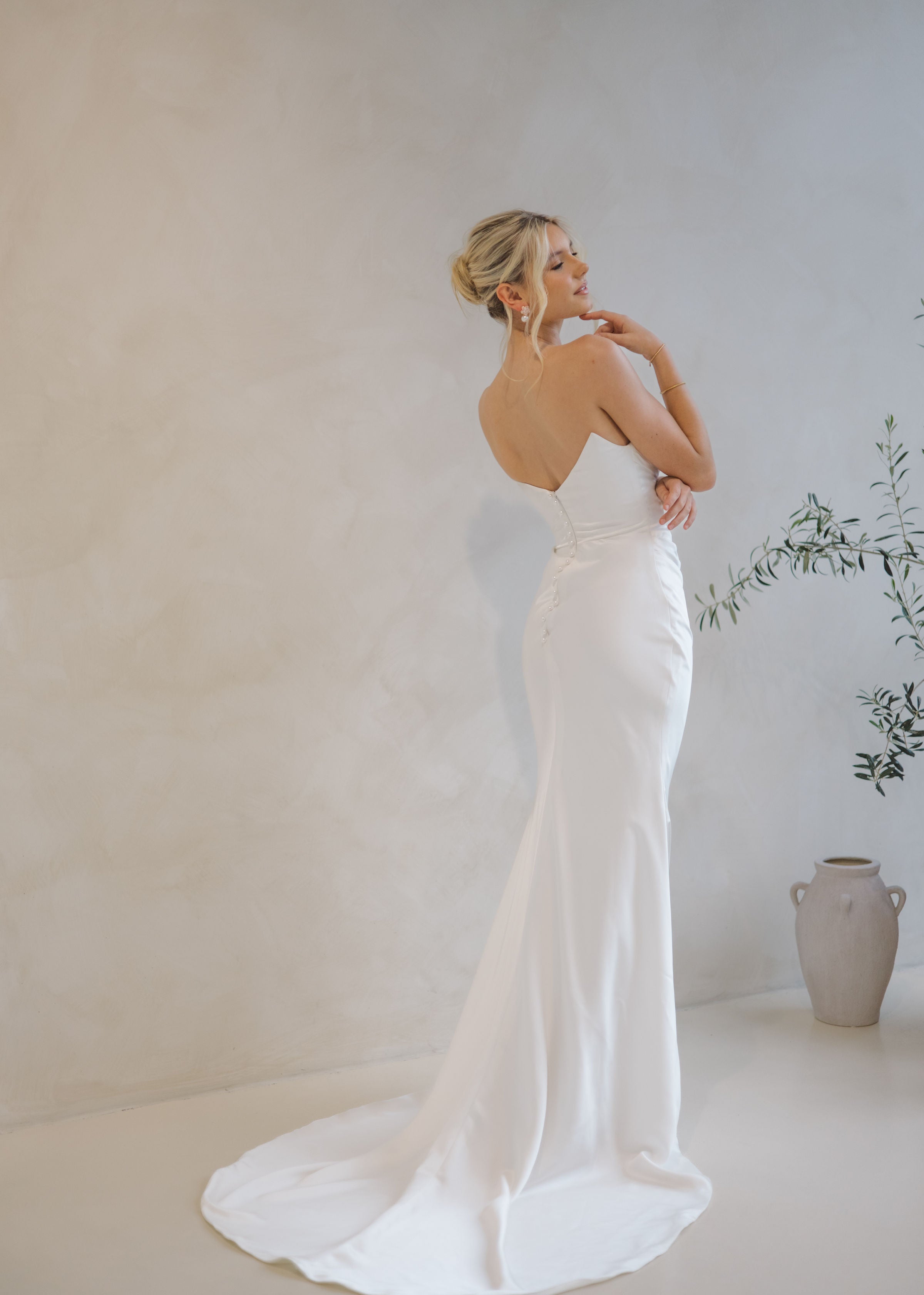 Intentions crepe satin fit-and-flare wedding dress with sweetheart neckline and elegant open back.