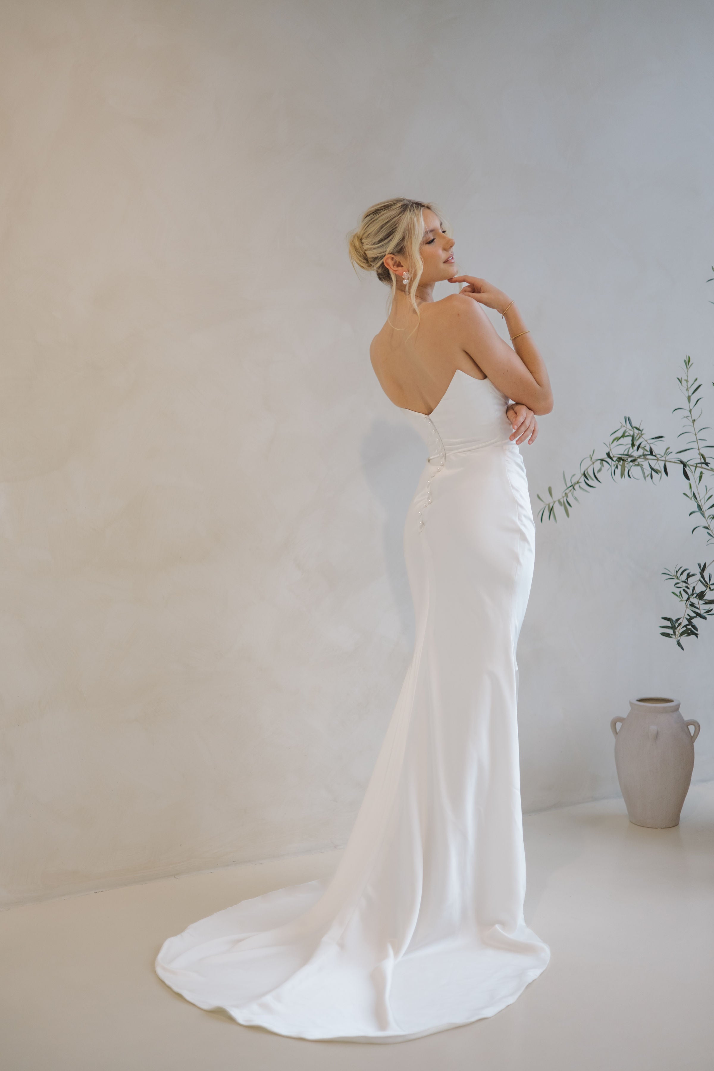 Intentions crepe satin fit-and-flare wedding dress with sweetheart neckline and elegant open back.