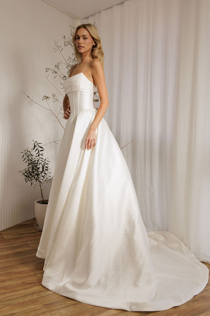 Mayfair designer wedding gown with structured bodice and voluminous skirt