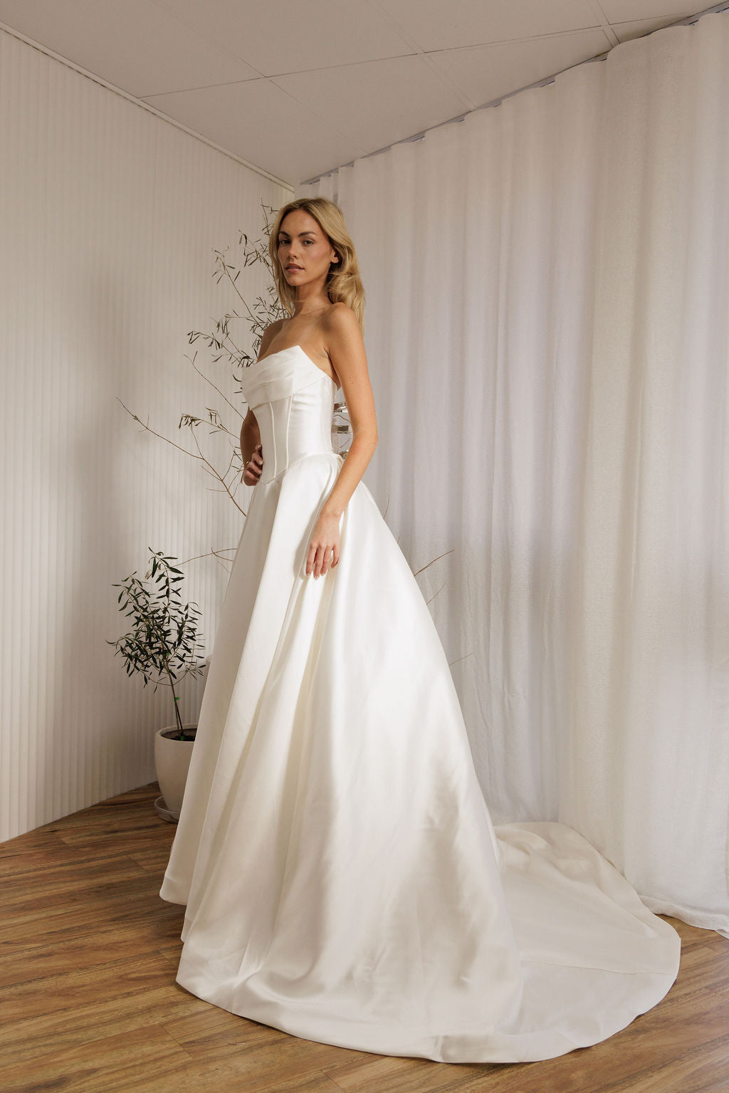 Mayfair designer wedding gown with structured bodice and voluminous skirt