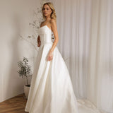 Mayfair designer wedding gown with structured bodice and voluminous skirt